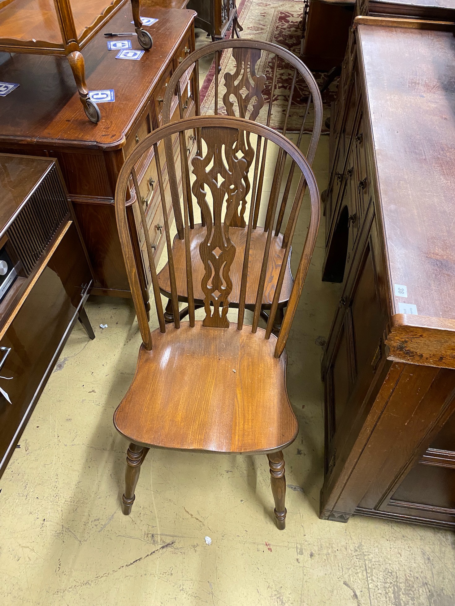 Five reproduction Windsor elm and beech dining chairs, one with arms